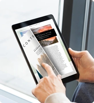 reading an online magazine on tablet