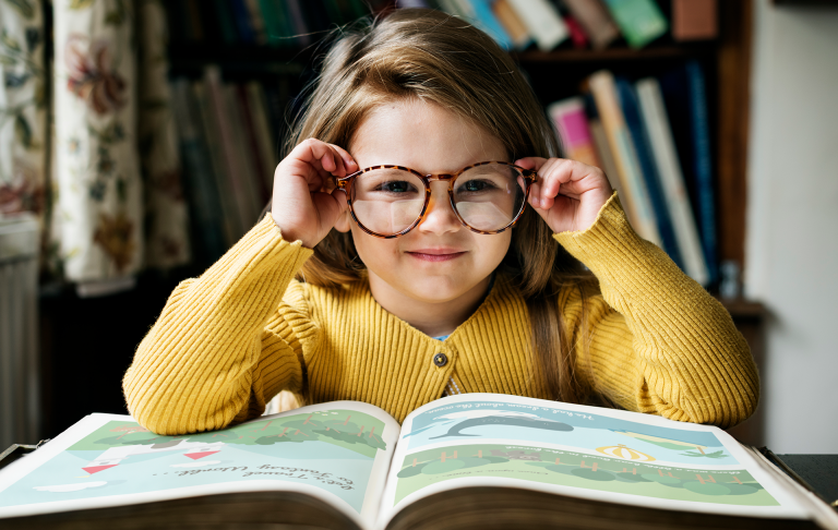 girl reading a colorful book